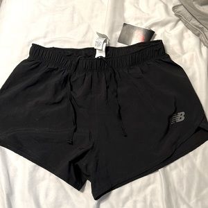 double lined NB small black, tennis shorts. Seem to run a tad big to me.